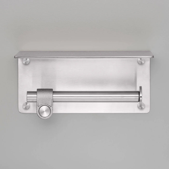 Front view of Buster + Punch Cast toilet roll holder with shelf in steel finish