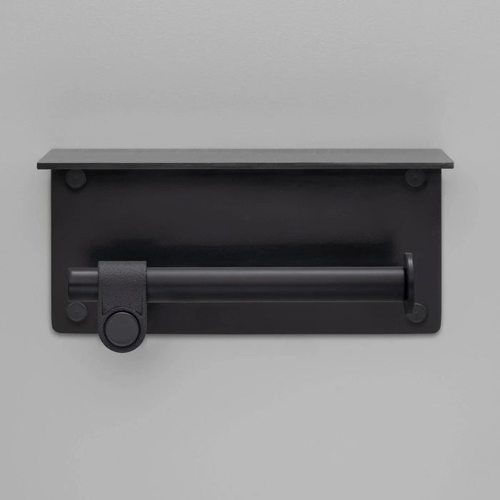 Front view of Buster + Punch Cast toilet roll holder with shelf in welders black finish