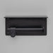 Front view of Buster + Punch Cast toilet roll holder with shelf in welders black finish