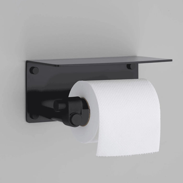 Buster + Punch Cast toilet roll holder with shelf in welders black finish holding toilet paper roll