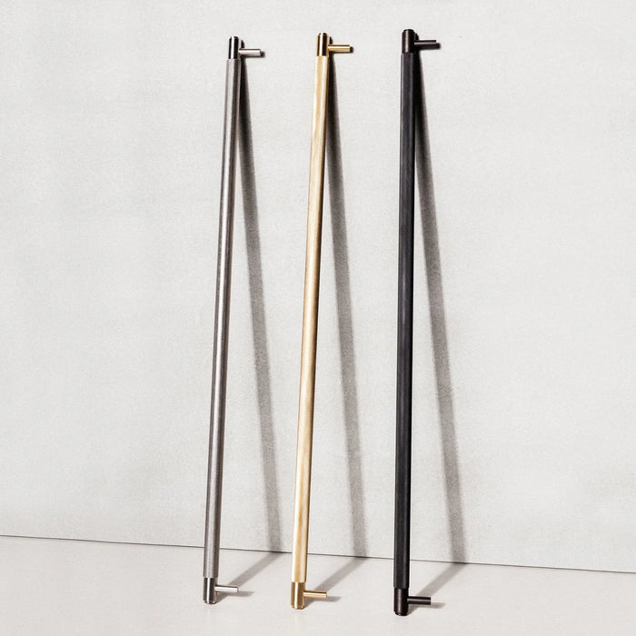 Buster + Punch Closet Bar Cross shown in brass, steel, and smoked bronze finishes