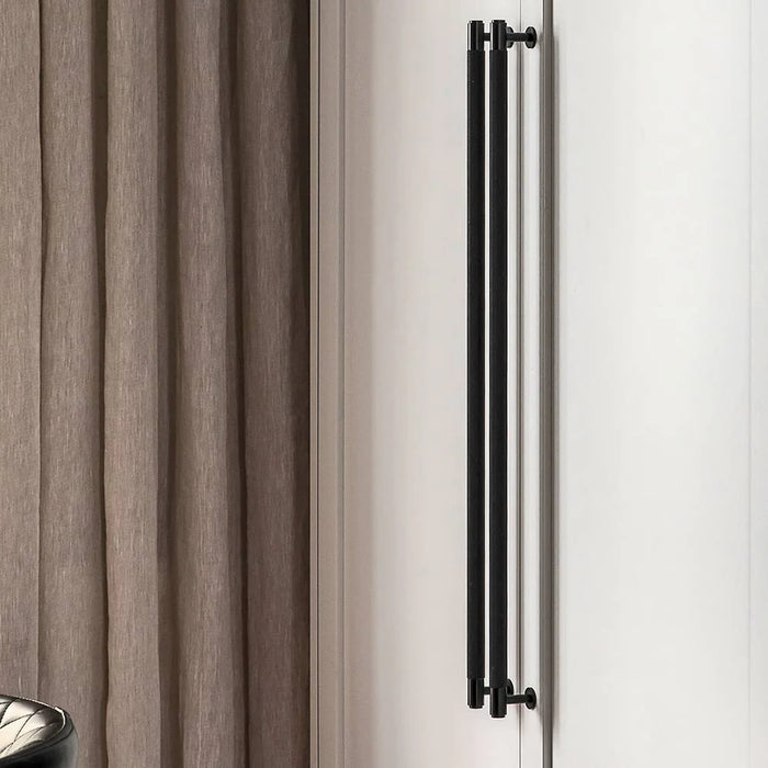 Buster + Punch black closet bar installed beside curtain wardrobe system