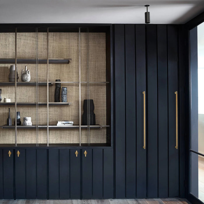 Modern luxury interior featuring Buster + Punch Closet Bar Cross in brass finish