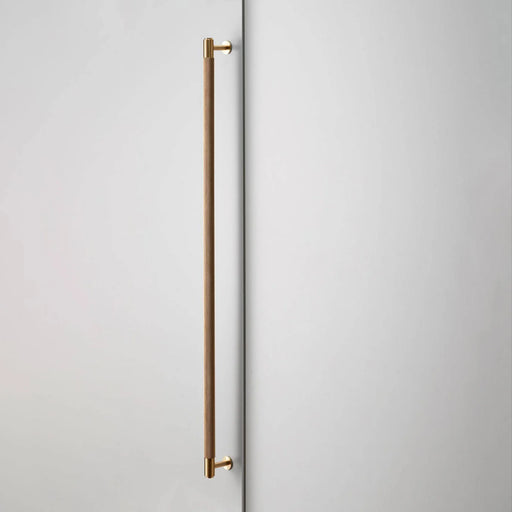 Buster + Punch Closet Bar Cross in brass finish mounted on wardrobe door