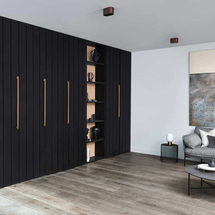 Brass finish Buster + Punch Closet Bar Cross in contemporary interior space