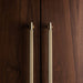 Buster + Punch brass closet bar installed on luxury wood wardrobe doors