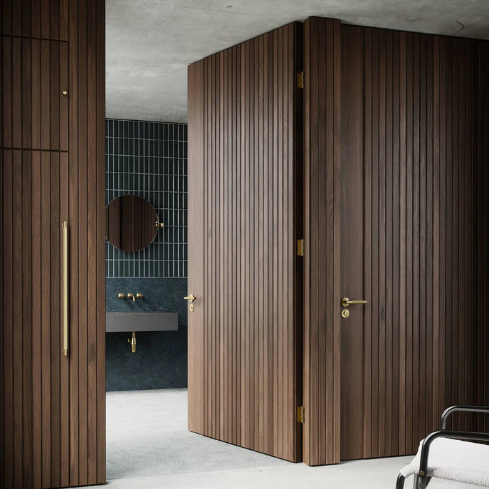 Modern luxury interior featuring Buster + Punch Closet Bar Cross in brass finish
