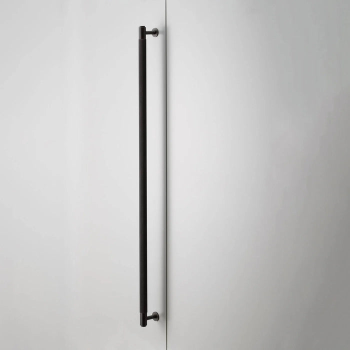 Side profile of Buster + Punch Closet Bar Cross in smoked bronze finish