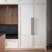 Black finish Buster + Punch Closet Bar Cross installed on white closet cabinetry