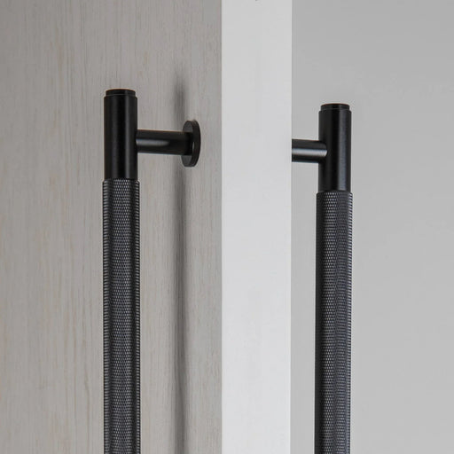 Close-up detail of Buster + Punch Closet Bar Double-Sided Cross in Black finish