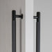 Close-up detail of Buster + Punch Closet Bar Double-Sided Cross in Black finish