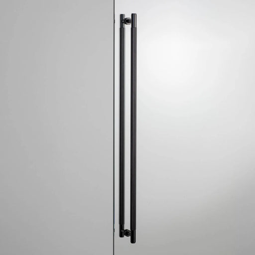 Buster + Punch Closet Bar Double-Sided Cross in Black finish mounted on modern wardrobe door