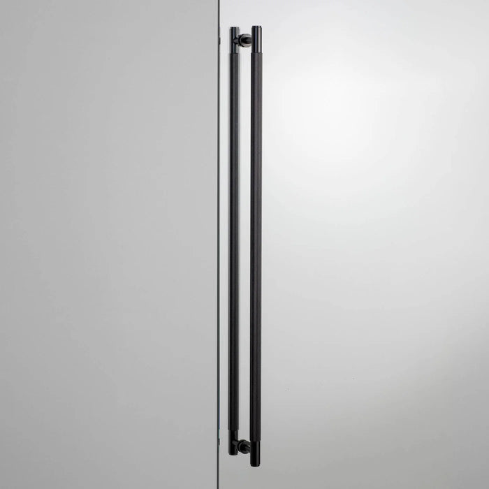 Buster + Punch Closet Bar Double-Sided Cross in Black finish mounted on modern wardrobe door