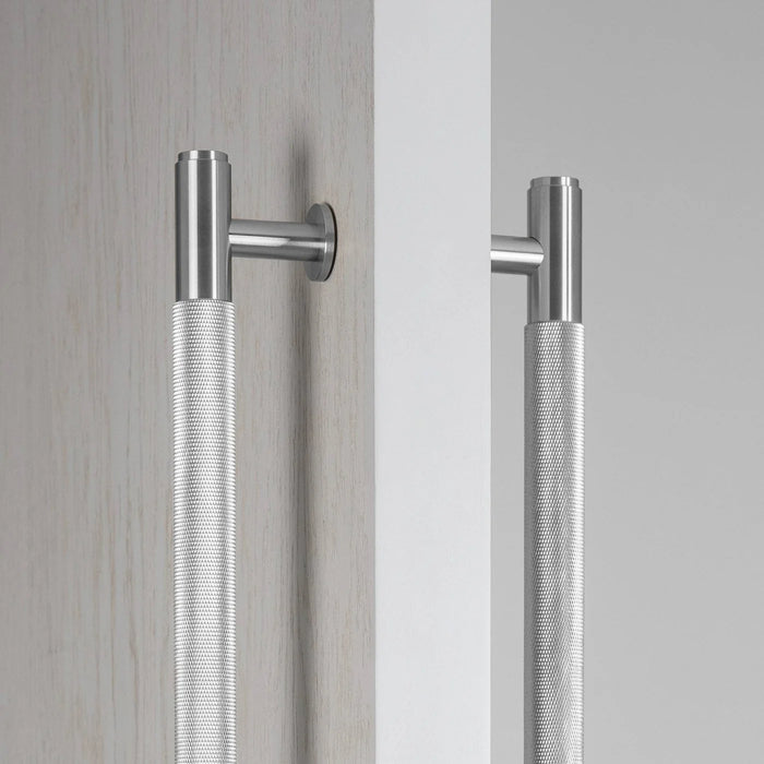 Close-up detail of Buster + Punch Closet Bar Double-Sided Cross in Steel finish