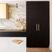 Brass Buster + Punch Cross Pull Bar handles installed on luxury wardrobe doors