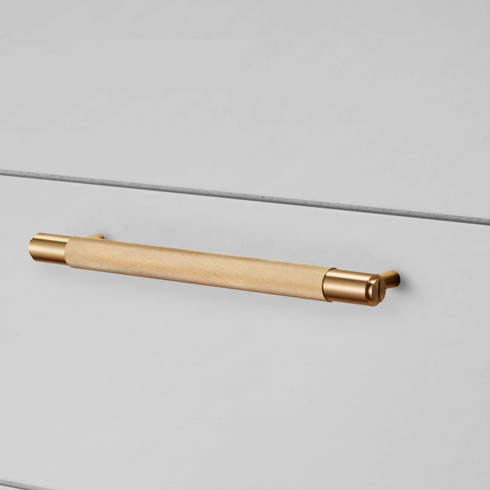 Buster + Punch Cross Pull Bar handle in Brass finish medium size installed