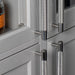 Steel Buster + Punch Cross Pull Bar handles installed on modern kitchen cabinets