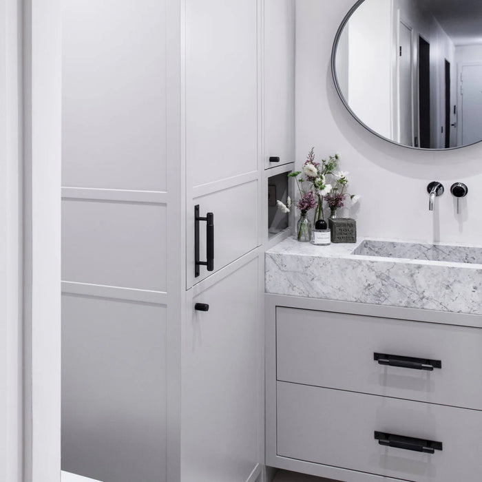 Buster + Punch Cross Pull Bar with Backplate in Black finish on modern bathroom vanity drawers