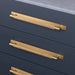 Brass Buster + Punch Cross Pull Bar with Backplate installed on luxury drawers large size