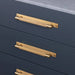 Brass Buster + Punch Cross Pull Bar with Backplate installed on luxury cabinetry medium size