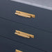Brass Buster + Punch Cross Pull Bar with Backplate installed on modern cabinet drawers small size