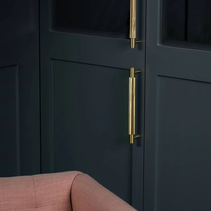 Brass Buster + Punch Cross Pull Bar with Backplate installed on luxury wardrobe doors