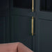 Brass Buster + Punch Cross Pull Bar with Backplate installed on luxury wardrobe doors