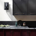 Buster + Punch Cross Pull Bar with Backplate in Smoked Bronze finish installed on dark kitchen cabinets