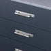 Steel Buster + Punch Cross Pull Bar with Backplate installed on modern cabinet drawers small size