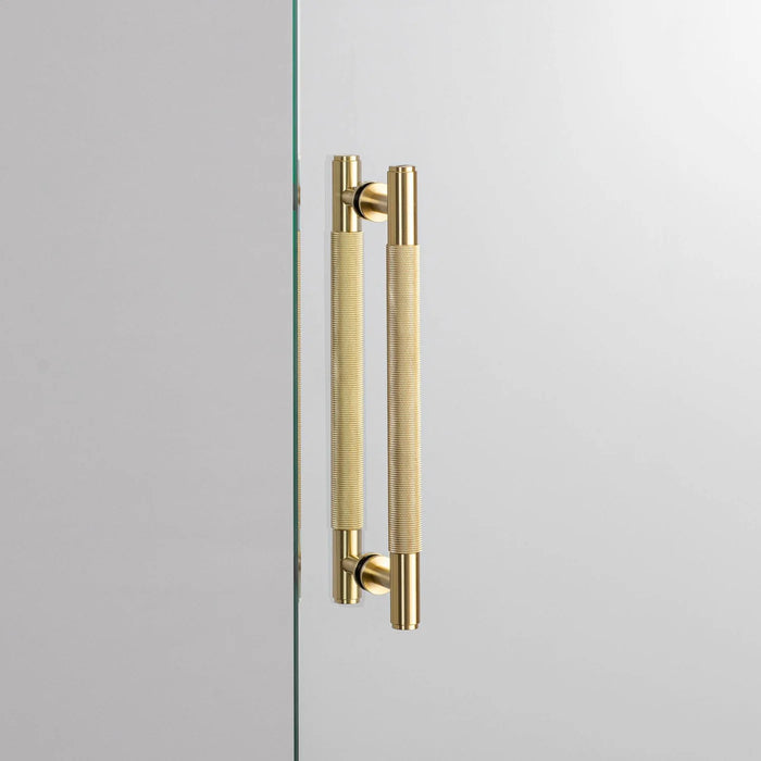 Buster + Punch Double-Sided Pull Bar Cross in brass finish front view