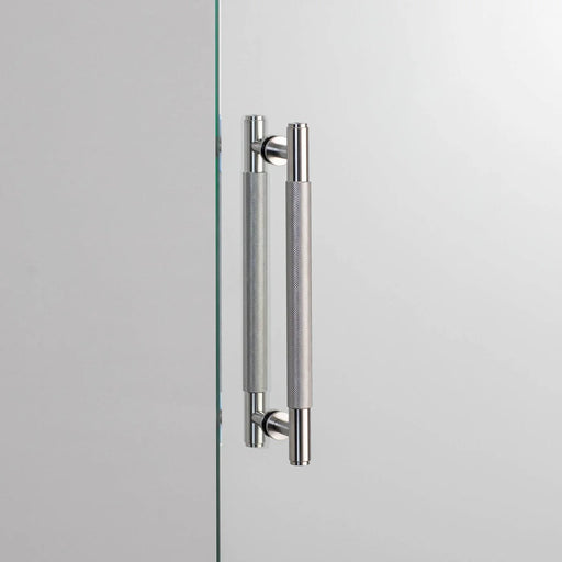 Buster + Punch Double-Sided Pull Bar Cross in steel finish front view on glass door