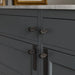 Buster + Punch Furniture Knob Cross in smoked bronze finish installed on cabinet doors