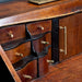 Buster + Punch Linear Brass furniture knobs installed on vintage wooden drawers
