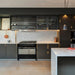 Luxury kitchen featuring Buster + Punch Cross Brass cabinet hardware