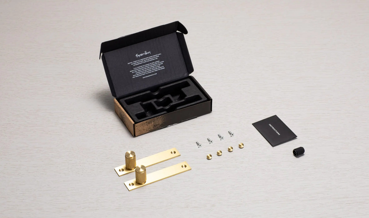 Buster + Punch Furniture Knob Plate Cross in Brass finish with packaging and included hardware components