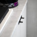 Side angle view of Buster + Punch Linear Gun Metal furniture knob plate