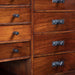 Vintage wooden cabinetry with Buster + Punch Linear Gun Metal knob plates