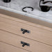 Buster + Punch Linear Gun Metal furniture knob plates installed on wood drawers