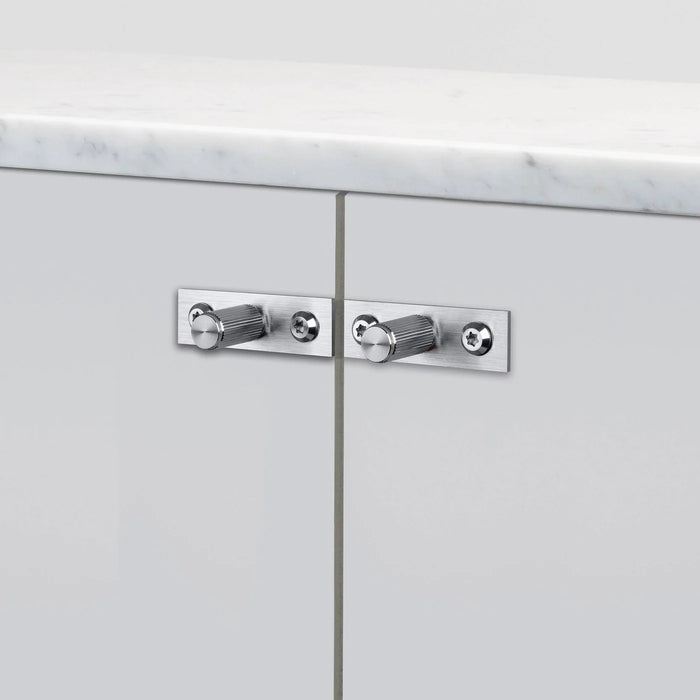 Close-up of Buster + Punch Furniture Knob Plate Linear in Steel finish