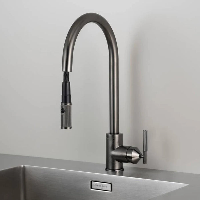 Angled view of Buster + Punch gun metal linear kitchen faucet