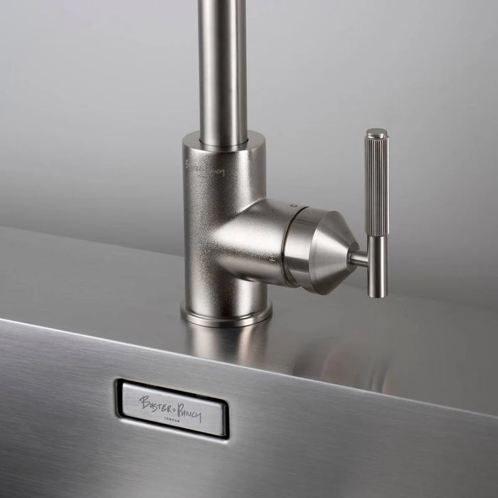 Close-up of Buster + Punch gun metal kitchen faucet handle and base