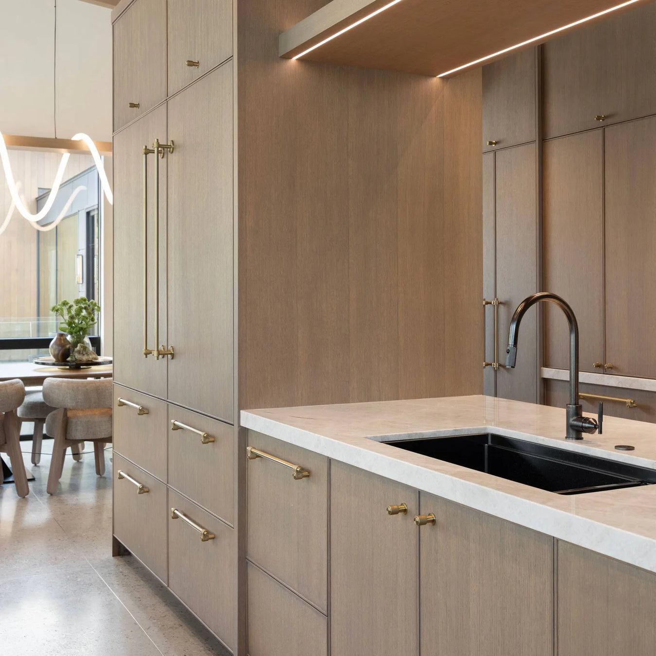 Buster + Punch linear kitchen faucet installed in modern luxury kitchen