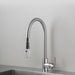 Angled view of Buster + Punch steel kitchen faucet with pull-out spray