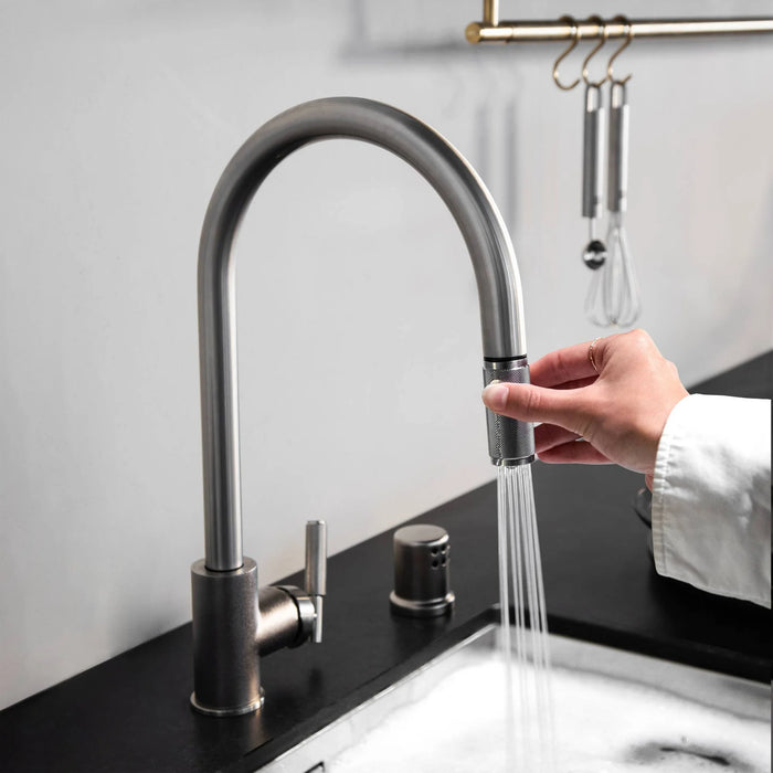Buster + Punch steel kitchen faucet using dual spray function