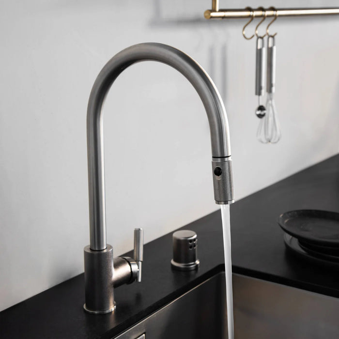 Running water from Buster + Punch linear pull-out kitchen faucet in steel finish