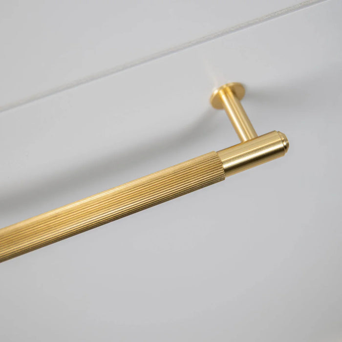 Close up of Buster + Punch Linear Pull Bar handle in Brass finish
