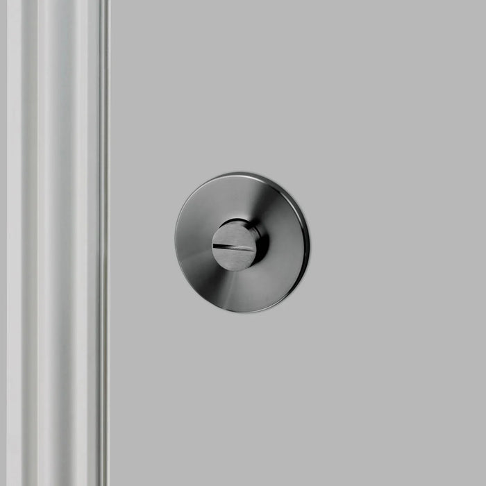 Close-up detail of Buster + Punch Linear Thumbturn Lock in Gun Metal finish