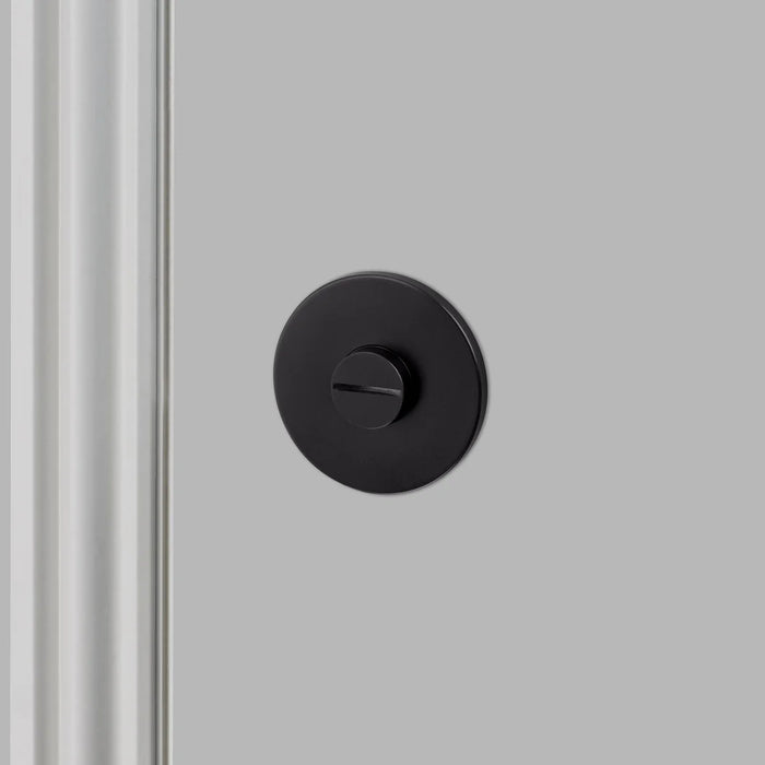 Front view of Buster + Punch Linear Thumbturn Lock in Welders Black finish