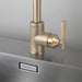 Close-up of Buster + Punch brass faucet with cross-knurled detailing