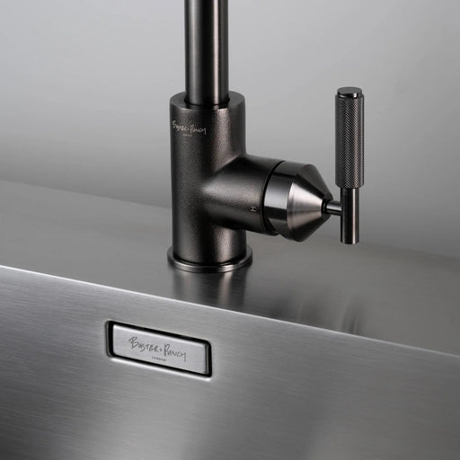 Close-up of Buster + Punch gun metal kitchen faucet handle and knurled detailing